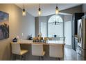 Bright breakfast nook with a glass table and ample natural light from bay windows at 528 Winding Oak Ln, Longwood, FL 32750