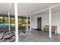 Covered patio features plenty of room for seating and entertaining guests at 1149 Shady Cove E Rd, Haines City, FL 33844