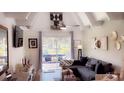 Cozy living room with ample seating, natural light, and a stylish decor at 4733 Club Cir, Lakeshore, FL 33854