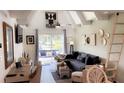 Cozy living room with ample seating, natural light, and a stylish decor at 4733 Club Cir, Lakeshore, FL 33854