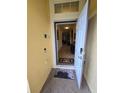 Inviting entryway with tiled flooring and a view into the spacious living area at 8923 Cuban Palm Rd, Kissimmee, FL 34747