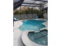 Screened-in pool with lounge chairs at 7607 Benji Ridge Trl, Kissimmee, FL 34747