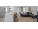 Open-concept space with a breakfast bar, seating, and modern finishes throughout at 1048 W Lime St, Lakeland, FL 33815
