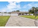 Well-maintained single-story home featuring a spacious driveway and inviting curb appeal at 5324 Messina, Lakeland, FL 33813