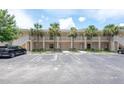 Condominium parking lot with palm trees, providing ample parking spaces for residents and visitors at 946 15Th St # 202, Daytona Beach, FL 32117