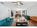 Spacious open-concept living area connected to a kitchen and dining space at 303 Briarbrook Ln, Haines City, FL 33844