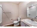 Cozy bathroom with single sink vanity and shower/tub combo; perfect for small spaces or as a convenient powder room at 738 Ambleside Dr, Haines City, FL 33844