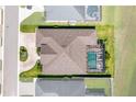 Aerial view of a house featuring a pool, lanai, and paver driveway at 3249 Pearly Dr, Lakeland, FL 33812