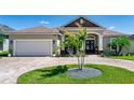 Inviting home featuring a brick-paved driveway and walkway, leading to a welcoming front entrance at 3249 Pearly Dr, Lakeland, FL 33812