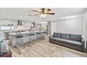 Spacious kitchen with a large island and seating that flows into the living room at 446 Eagle Cir, Casselberry, FL 32707