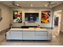 Modern living room with stylish decor, contemporary furniture, and unique artwork on the walls at 808 Edgewater Dr, Orlando, FL 32804