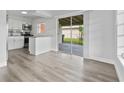 View of modern kitchen area leading to a patio through sliding glass doors at 5008 Vanguard St, Orlando, FL 32819