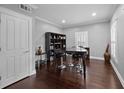 Bright office features hardwood floors, built-in shelving and a large table at 530 S Eola Dr, Orlando, FL 32801