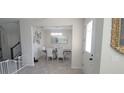 Bright dining room features modern decor and ample natural light at 1704 Felicity Ln, Kissimmee, FL 34744