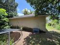 Back side of the house with grass and fence at 2656 Williston Dr, Lakeland, FL 33801