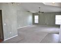 Spacious living room with neutral carpet, high ceilings, and lots of natural light at 3629 Welsh Way, Lakeland, FL 33813