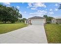 Lovely single-story home with a spacious driveway, lush green lawn, and a well-maintained exterior at 4189 Homestead Dr, Lakeland, FL 33810