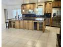 Spacious kitchen featuring granite countertops, stainless steel appliances, and ample storage space at 2514 Sage Dr, Kissimmee, FL 34758