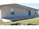 House exterior showcasing a large patio and grassy yard at 1562 Pendleton St, Deltona, FL 32725