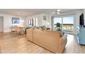 Open concept living room flowing into the dining area, with a balcony and ocean view at 1513 Ocean Shore Blvd # 7B, Ormond Beach, FL 32176