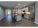 Modern kitchen featuring an island and stainless steel appliances at 257 Ancona Ave, Debary, FL 32713