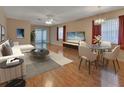Bright living room featuring a dining area, a sliding glass door, and modern decor at 47 Villa Villar Ct # 470, Deland, FL 32724
