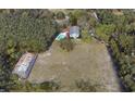 Expansive aerial view of Arroyo Vista property featuring the main house, pool, barn, and surrounding landscape at 1440 Arroyo Vista Dr, Deland, FL 32724