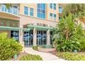 Inviting entrance to Ocean Villas with lush landscaping, a fountain, and a well-maintained facade, creating a welcoming ambiance at 3703 S Atlantic Ave # 501, Daytona Beach Shores, FL 32118