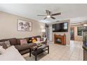 Spacious living room featuring a fireplace and large TV at 114 Palm Dr, Daytona Beach, FL 32117