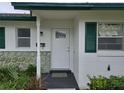 Charming home featuring a white front door and decorative stone accents at 201 N Hill Ave # 150, Deland, FL 32724