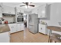 Renovated kitchen with stainless steel appliances and granite countertops at 714 E Michigan Ave, Deland, FL 32724