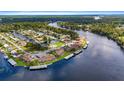 Stunning aerial view of a waterfront community with private boat docks and lush landscaping at 1640 Juno Trl # 205A, Astor, FL 32102