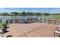 Waterfront home featuring a private wooden dock with railings offering stunning views at 1640 Juno Trl # 205A, Astor, FL 32102