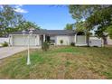 Charming single-Gathering home with attached garage and well-maintained front lawn at 1083 E Normandy Blvd, Deltona, FL 32725