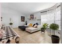 Bright living room with neutral colors, tile floor, and comfortable seating at 1083 E Normandy Blvd, Deltona, FL 32725