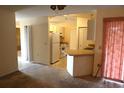 Simple kitchen with white appliances and wood-look countertops at 1201 Buccaneer Ave, Deltona, FL 32725