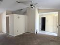 Living room with carpeted floors and neutral-colored walls at 1201 Buccaneer Ave, Deltona, FL 32725