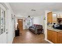 Bright living room with hardwood floors and kitchen view at 1540 Primrose Ln, Daytona Beach, FL 32117