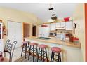 Bright kitchen features ample counter space and a breakfast bar with seating at 2573 Delaware Rd, Deltona, FL 32738