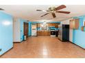 Spacious kitchen featuring wood cabinets and tile flooring at 1391 San Carlos Ave, Deltona, FL 32738
