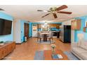 Bright kitchen and dining area with tile floors and modern appliances at 1391 San Carlos Ave, Deltona, FL 32738