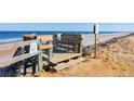 Wooden steps leading to beach at 2700 Ocean Shore Blvd # 317, Ormond Beach, FL 32176