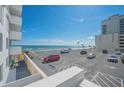 An ocean view from the condo balcony of the parking area, beach, and ocean at 2800 N Atlantic Ave # 212, Daytona Beach, FL 32118