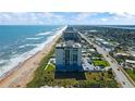Beachfront building, coastal road and ocean views at 1513 Ocean Shore Blvd # 2B, Ormond Beach, FL 32176