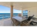 Oceanfront balcony with patio furniture, offering breathtaking ocean views at 1925 S Atlantic Ave # 706, Daytona Beach, FL 32118