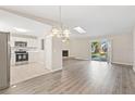 Open living room with kitchen and fireplace views at 2125 Queen Palm Dr, Edgewater, FL 32141