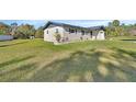 Charming ranch-style home, newly landscaped front yard at 3070 Grand Ave, Deland, FL 32720