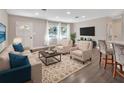 Spacious living room with hardwood floors and modern furniture at 3070 Grand Ave, Deland, FL 32720