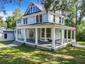 Two-story craftsman home with a large wraparound porch at 345 N Clara Ave, Deland, FL 32720