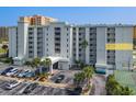 Ocean Terrace Club condo building exterior, showing parking and landscaping at 3800 S Atlantic Ave # 4080, Daytona Beach, FL 32118
